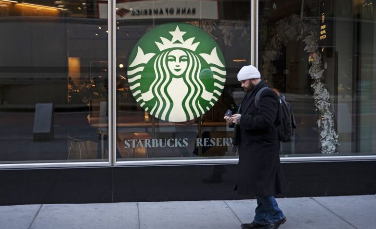  Starbucks to pay about $35M to NYC workers to settle claims it violated labor law